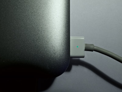 A close-up of a laptop battery being installed.