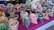 An assortment of colorful, beautifully packaged confectionery items displayed on a wooden table.