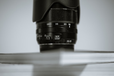 Close-up of camera lens focusing on a business presentation.