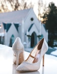 pair of glitter white pointed-toe pumps