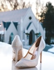 pair of glitter white pointed-toe pumps