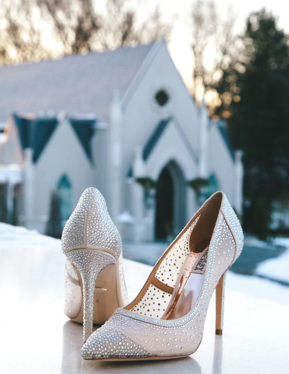 pair of glitter white pointed-toe pumps