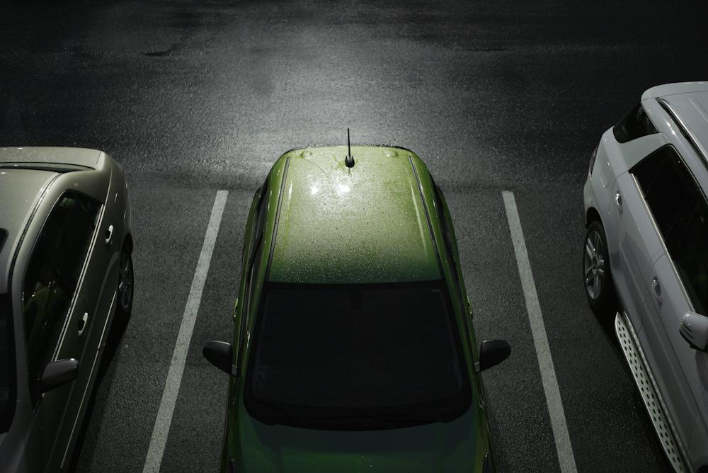 green car parked on the street