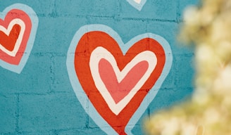 selective photo of red and white hearts graffiti