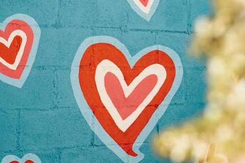 selective photo of red and white hearts graffiti