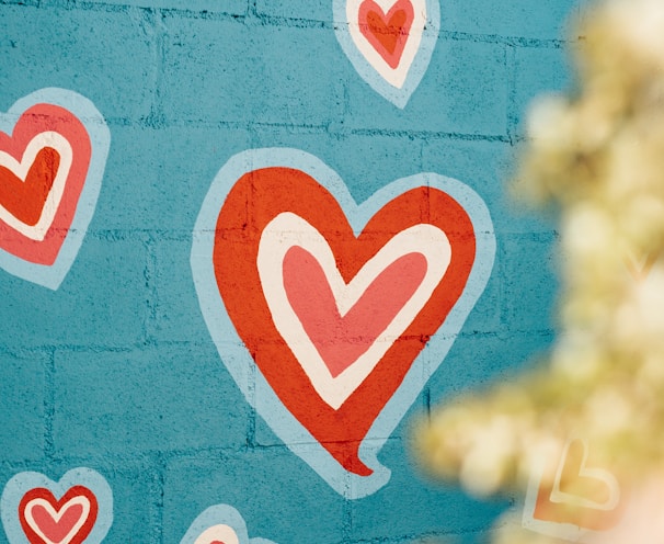 selective photo of red and white hearts graffiti