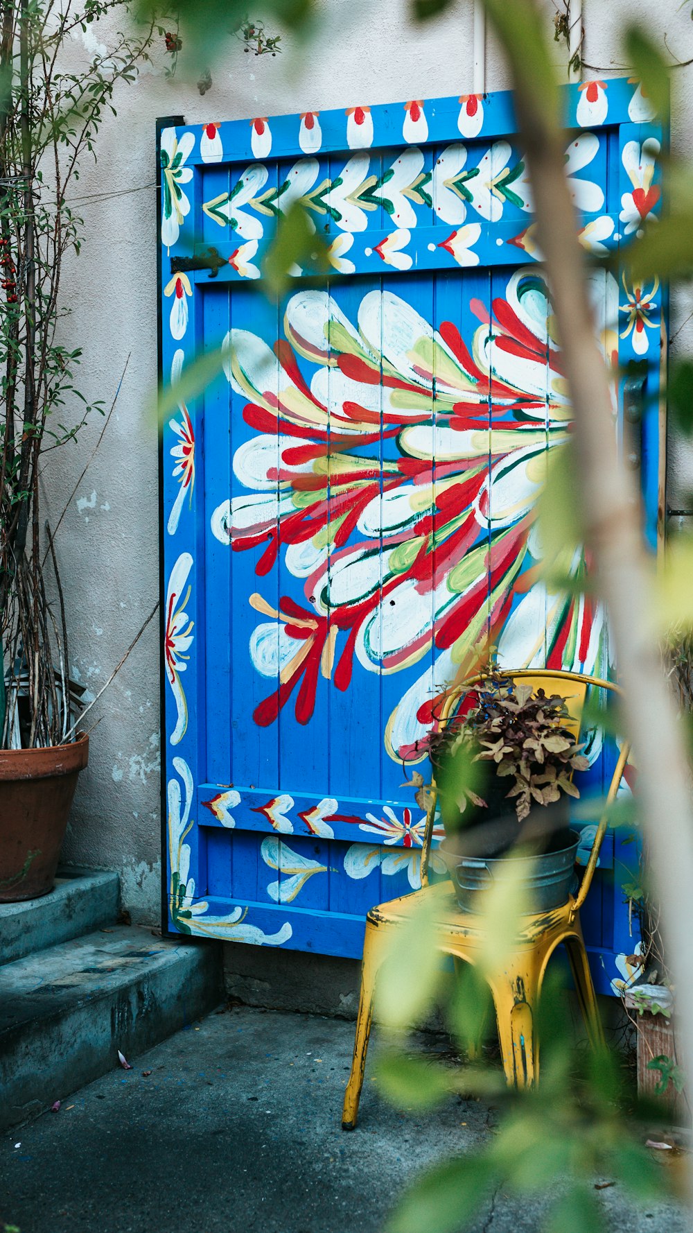 blue and white floral wooden door