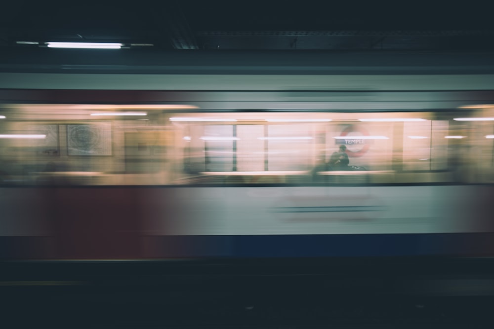 time lapse photo of speeding train