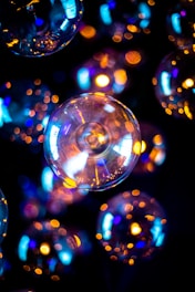 A glowing celestial light orb surrounded by ethereal mist and abstract floating marble sculptures.