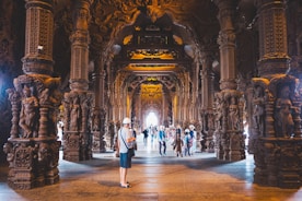 Spacious pendopo with wooden pillars and intricate carvings