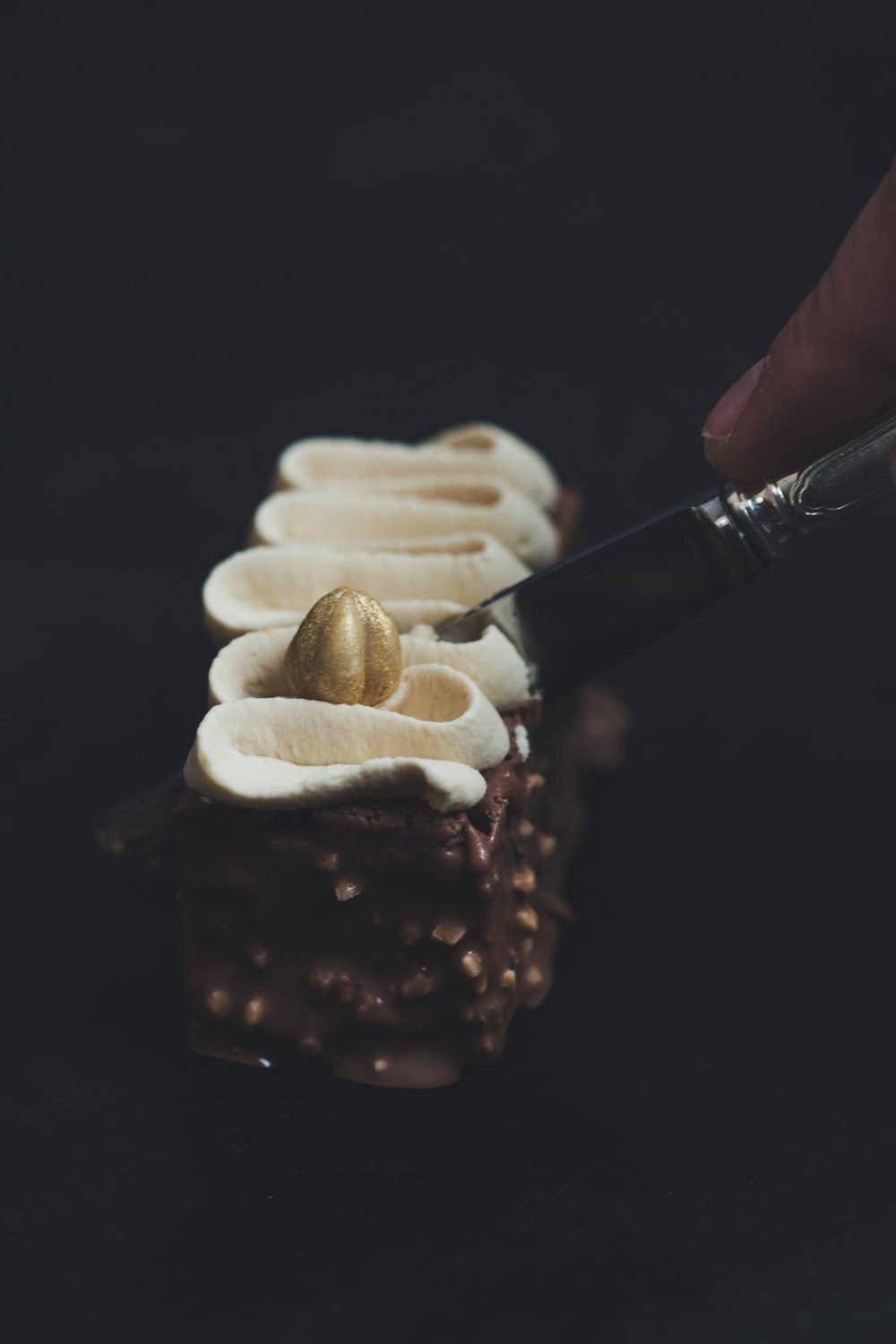 person slicing cake