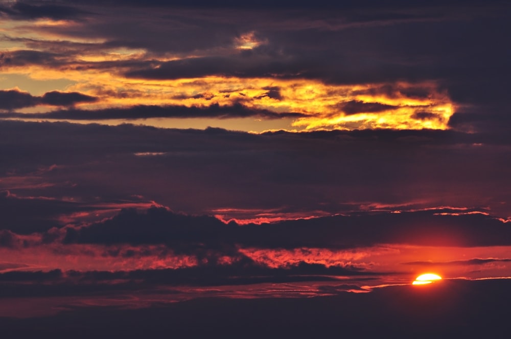 grey and red sky at sunset