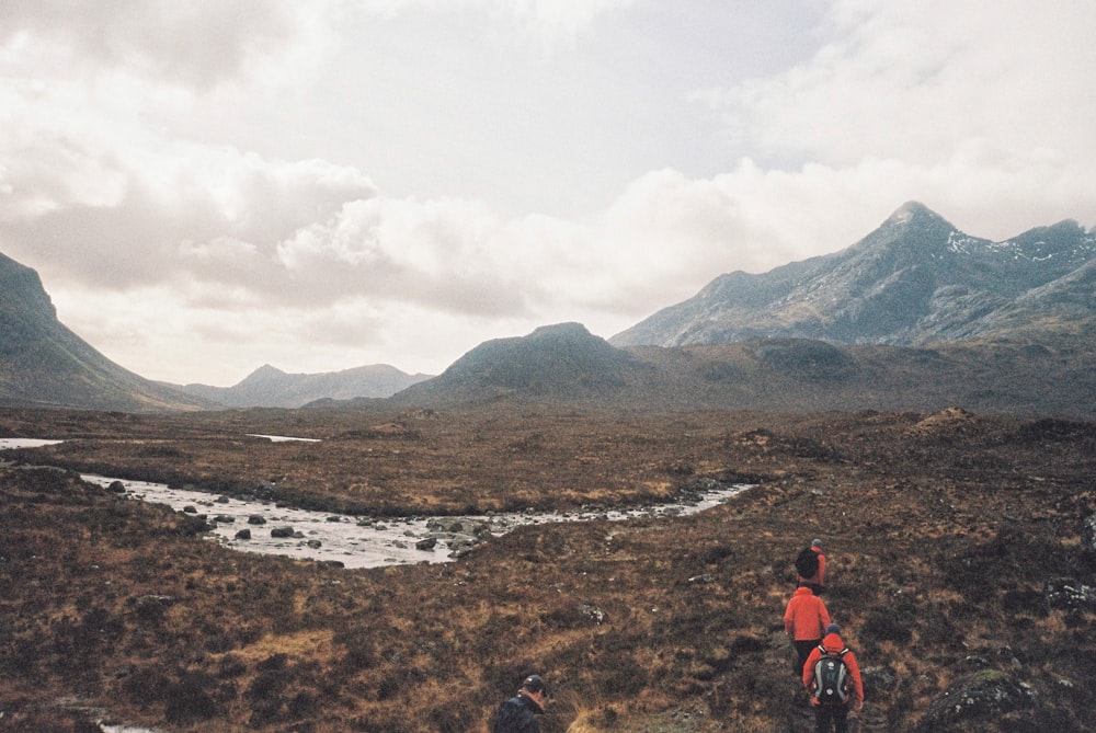 people walking on hill