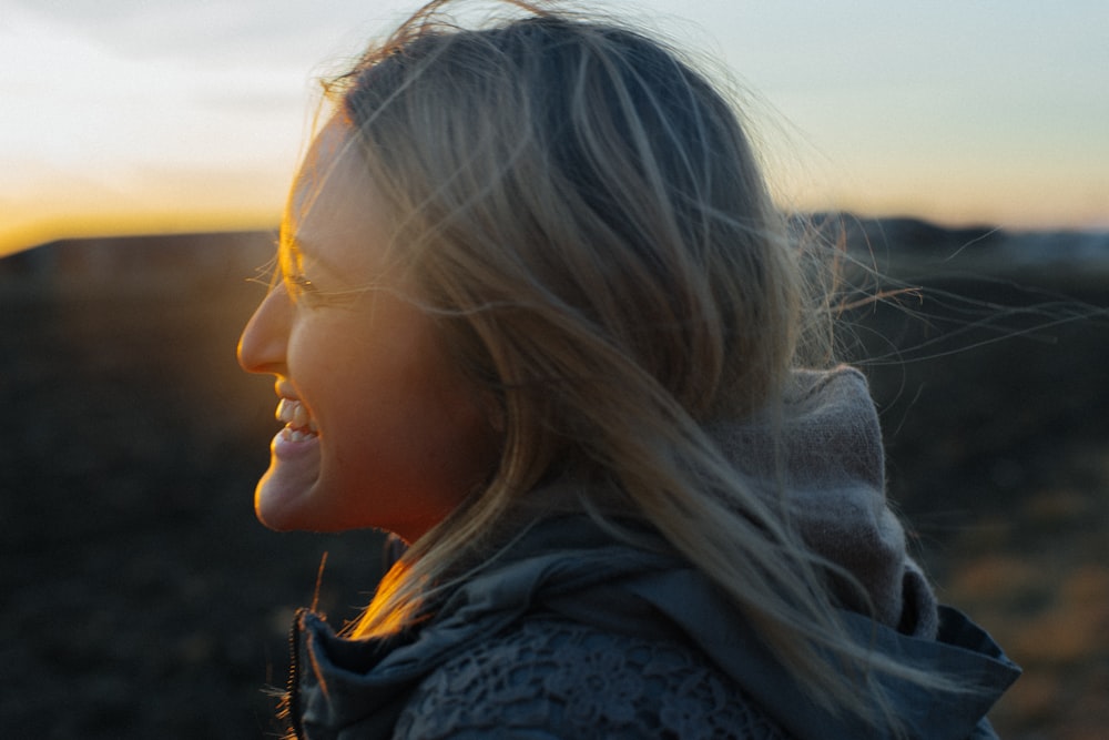 side view photograph of woman smiling