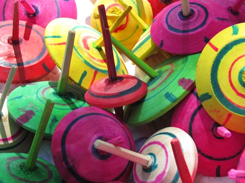 A colorful collection of recommended yoyos displayed on a wooden table.