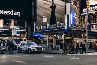 people walking on pedestrian lane near vehicles