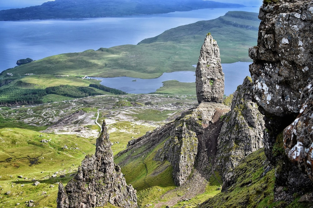 rock formation on green grass field