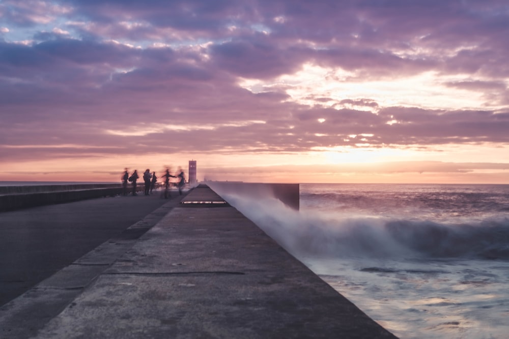 people standing near body of water