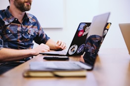 man sitting in front of laptop
