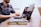 man sitting in front of laptop
