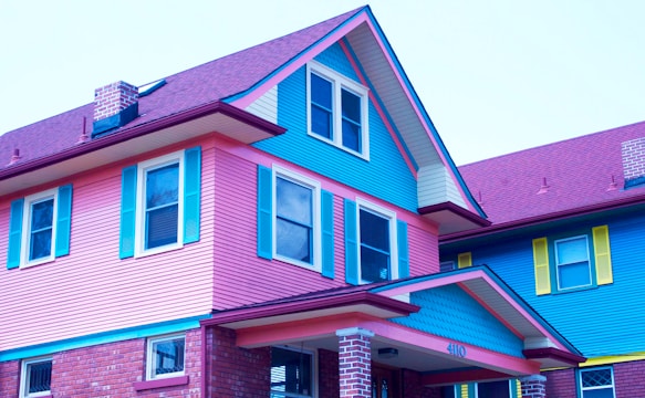 A vibrant house with newly installed siding.