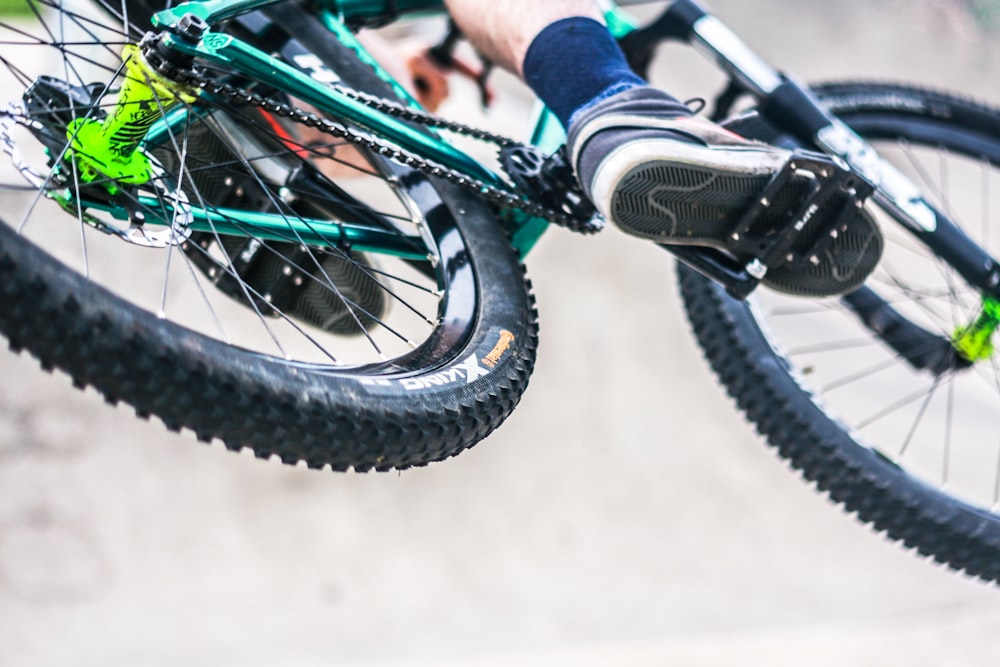 selective focus photography of person riding bike