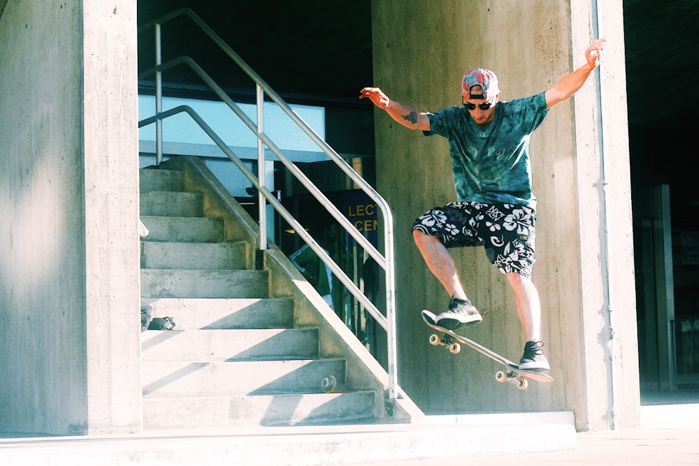 man skateboarding near stairs during daytime