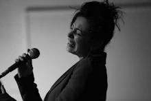 Portrait of a passionate singer mid-performance with expressive facial gestures