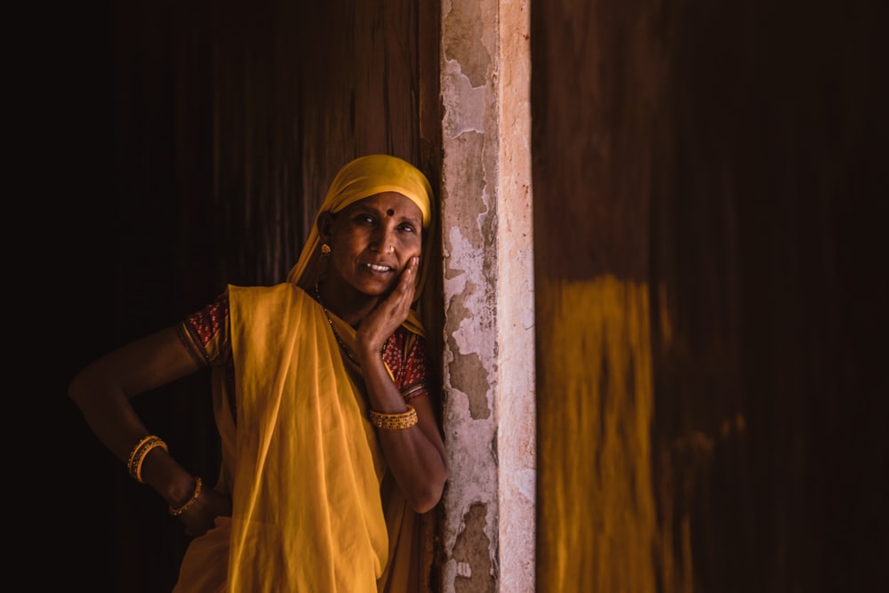 woman leaning on wall