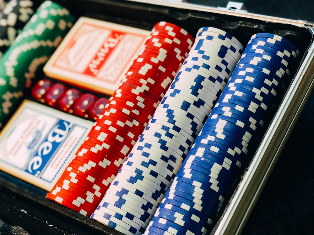 closeup photography of poker chip set