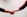 two person shaking hands near white painted wall