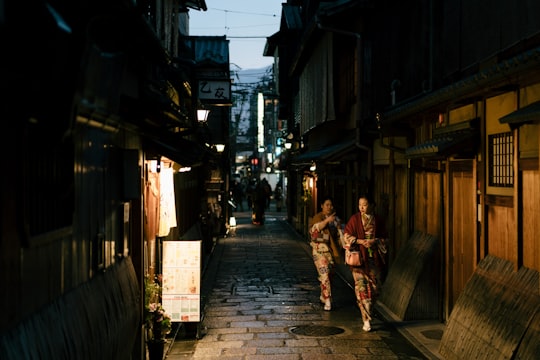 women walking on street in Gion Tatsumi Bridge Japan