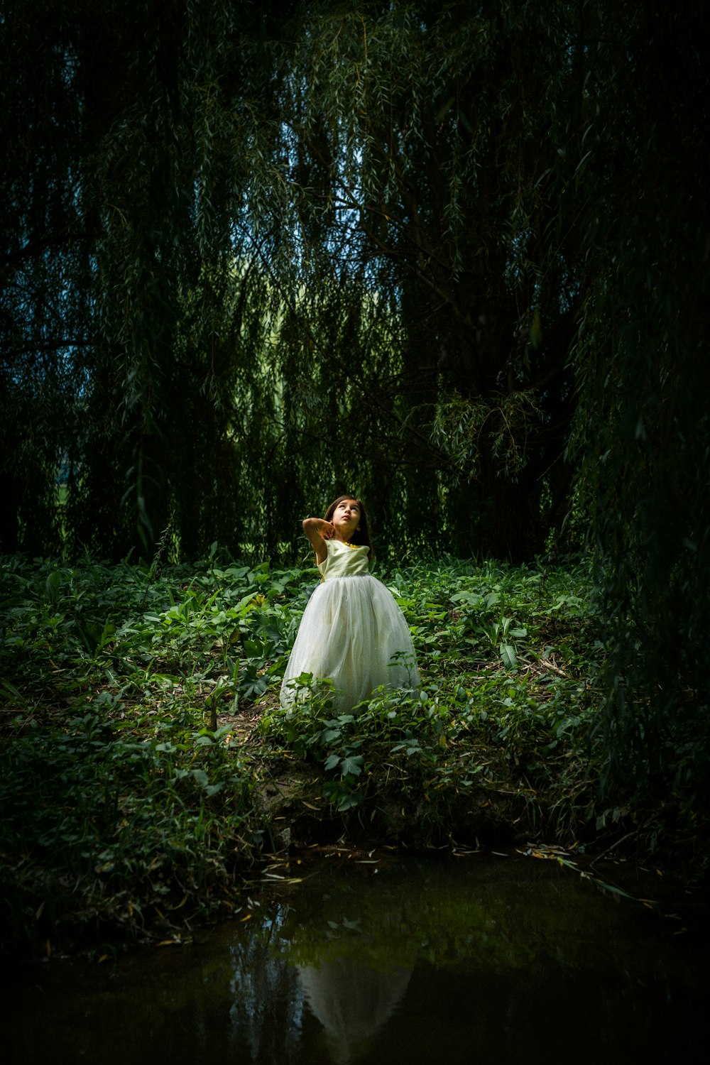 woman on woods wearing white dress