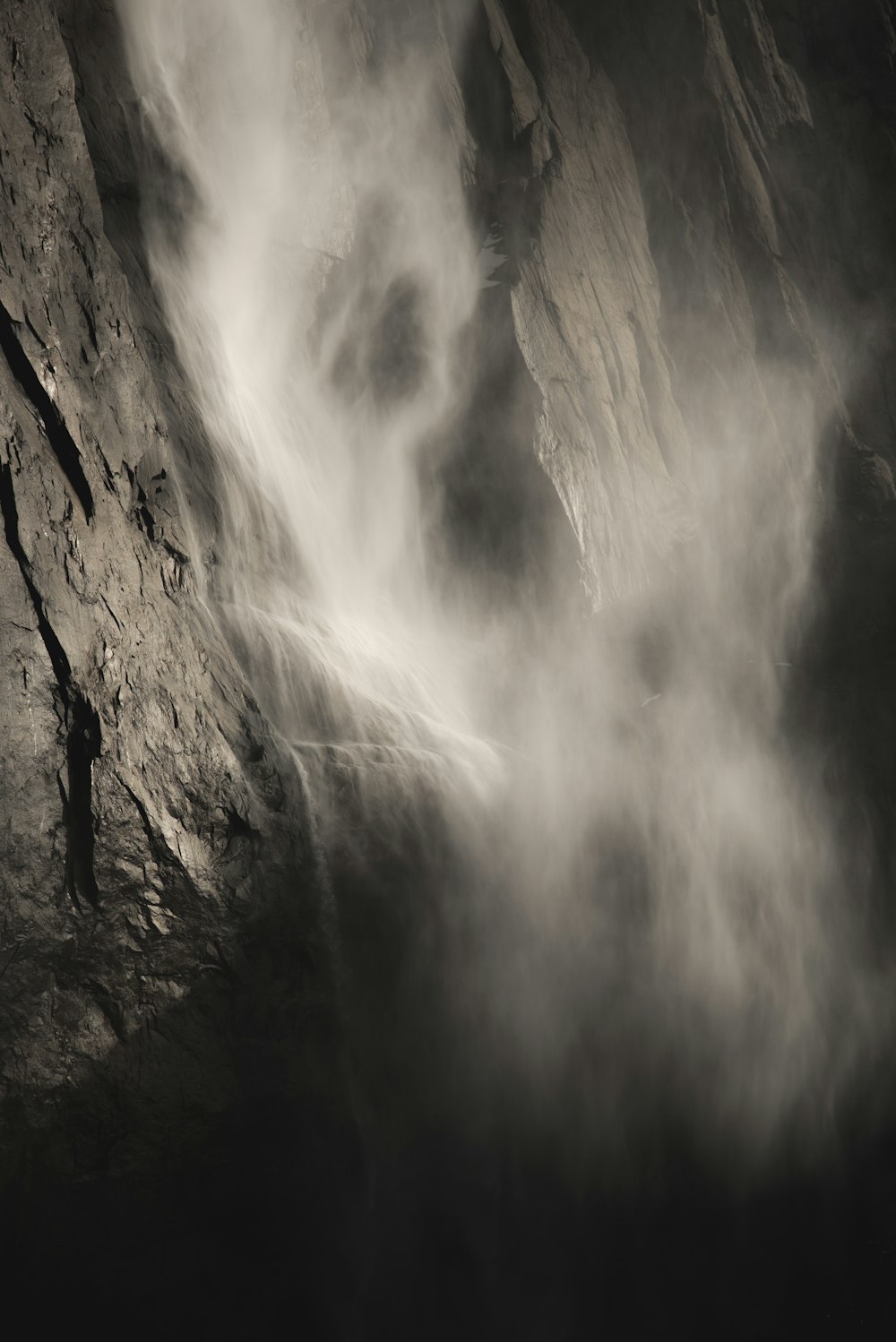 grayscale photo of waterfalls