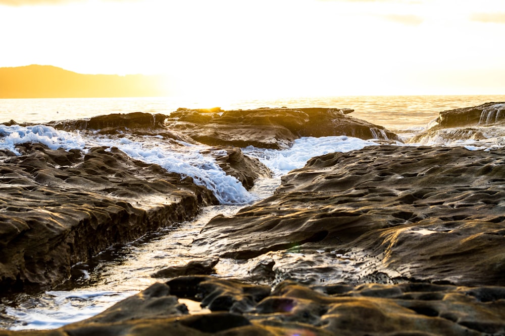 ocean waves crashing on shore during daytime