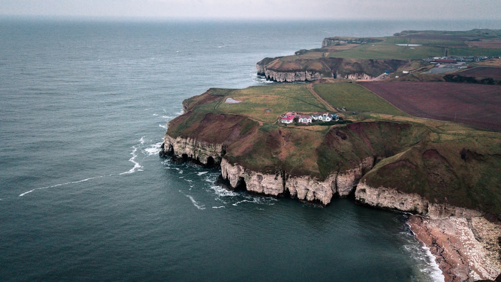 ocean waves of cliff during daytime