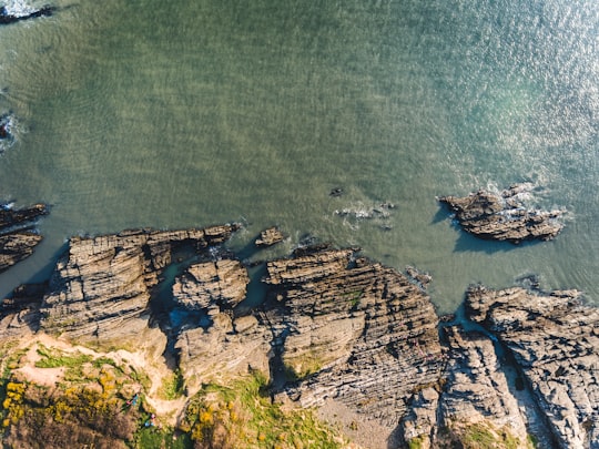 aerial photography of rocky shore during daytime in Croyde United Kingdom