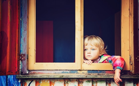 toddler looking at window