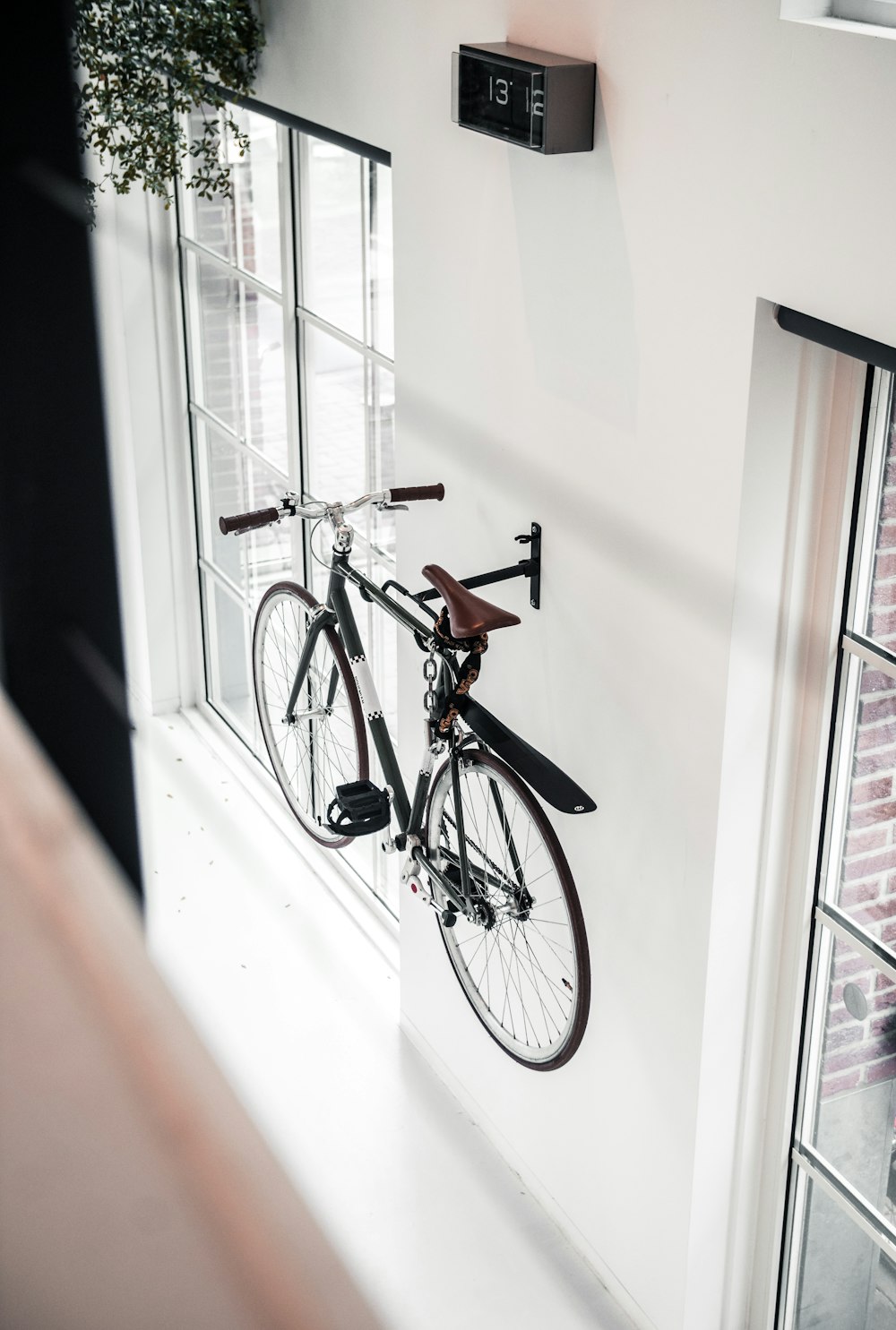 black mountain bicycle mounted on wall