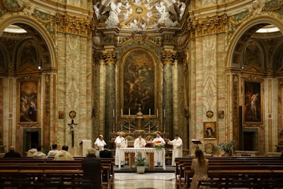 five priest inside cathedral pew google meet background