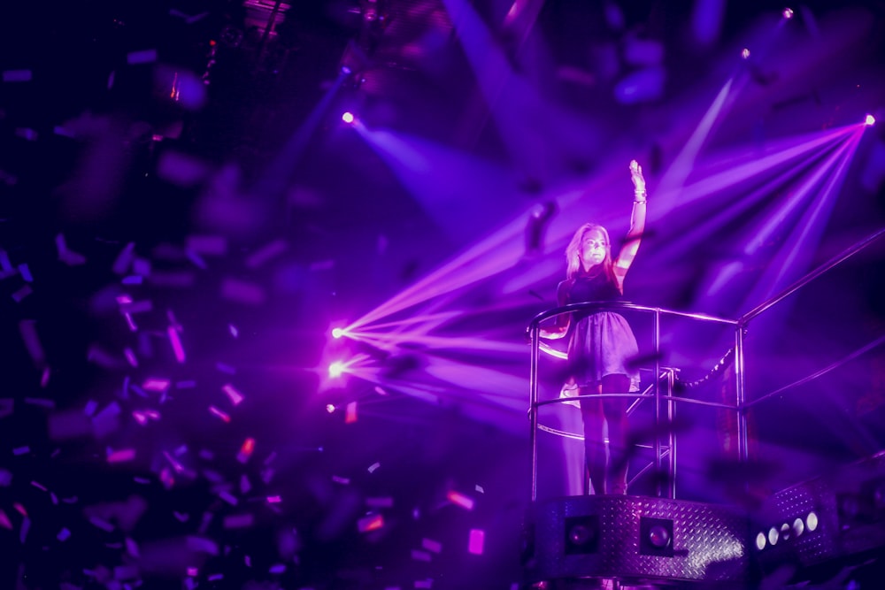 woman standing on stage