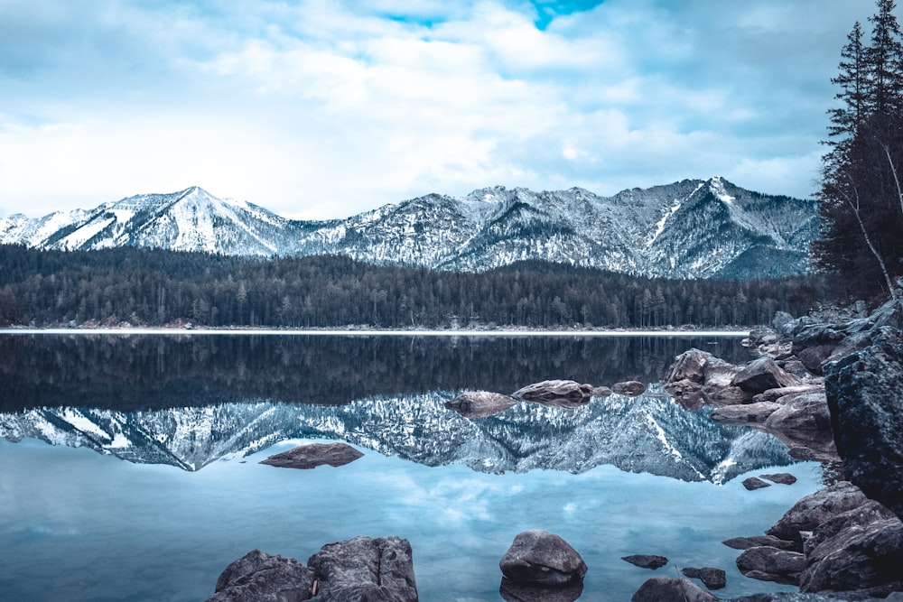 skyline photography of mountain and water