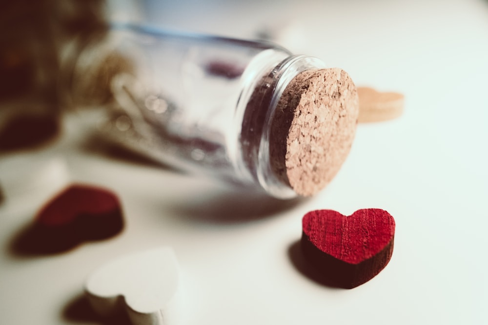 clear glass bottle and read heart decor