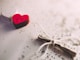 macro shot photography of red and white heart ornament