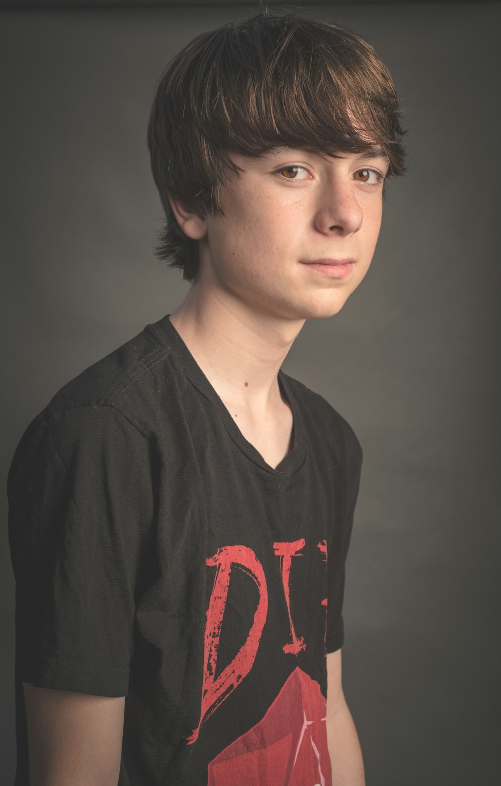 man wearing black and red shirt posing