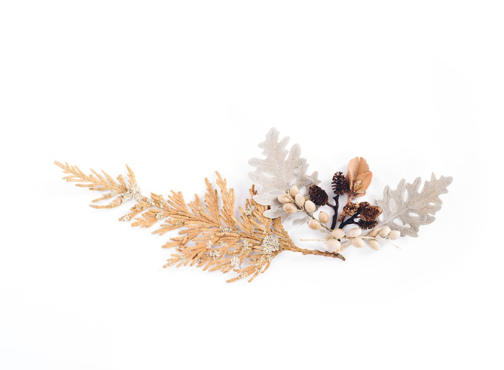 brown and gray leaves with white flower decor