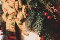 A close-up of a Christmas wreath adorned with festive decorations.