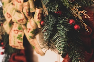A close-up of a Christmas wreath adorned with festive decorations.