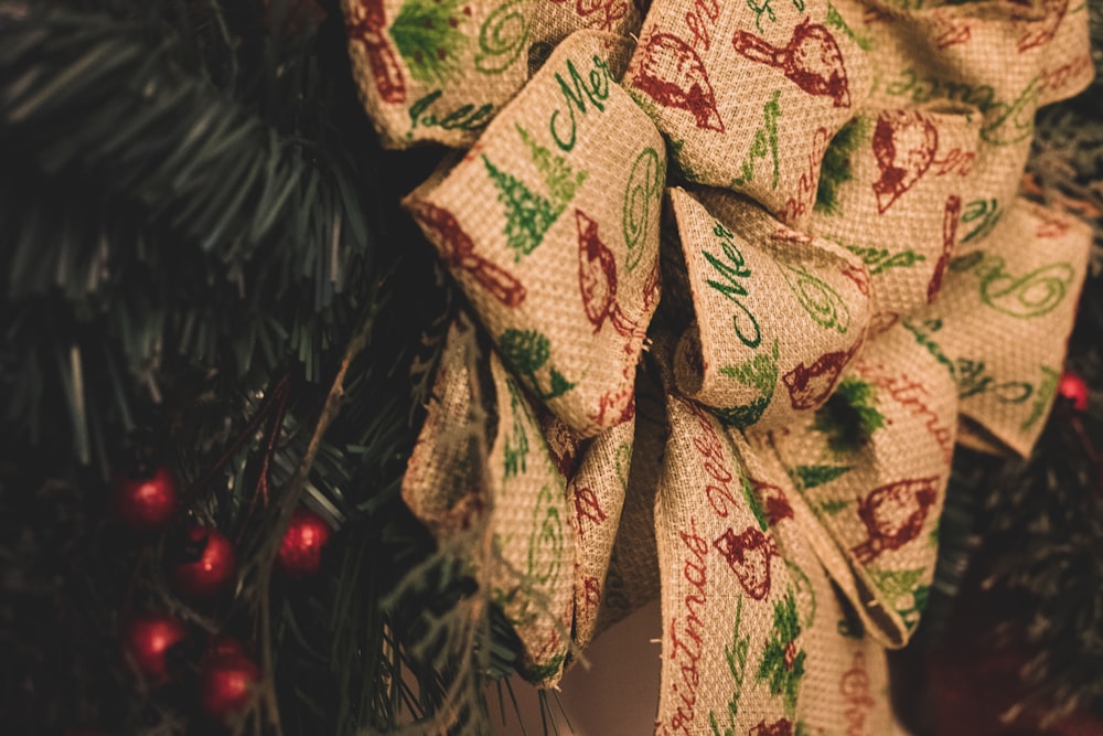 brown ribbon ornament on Holiday tree