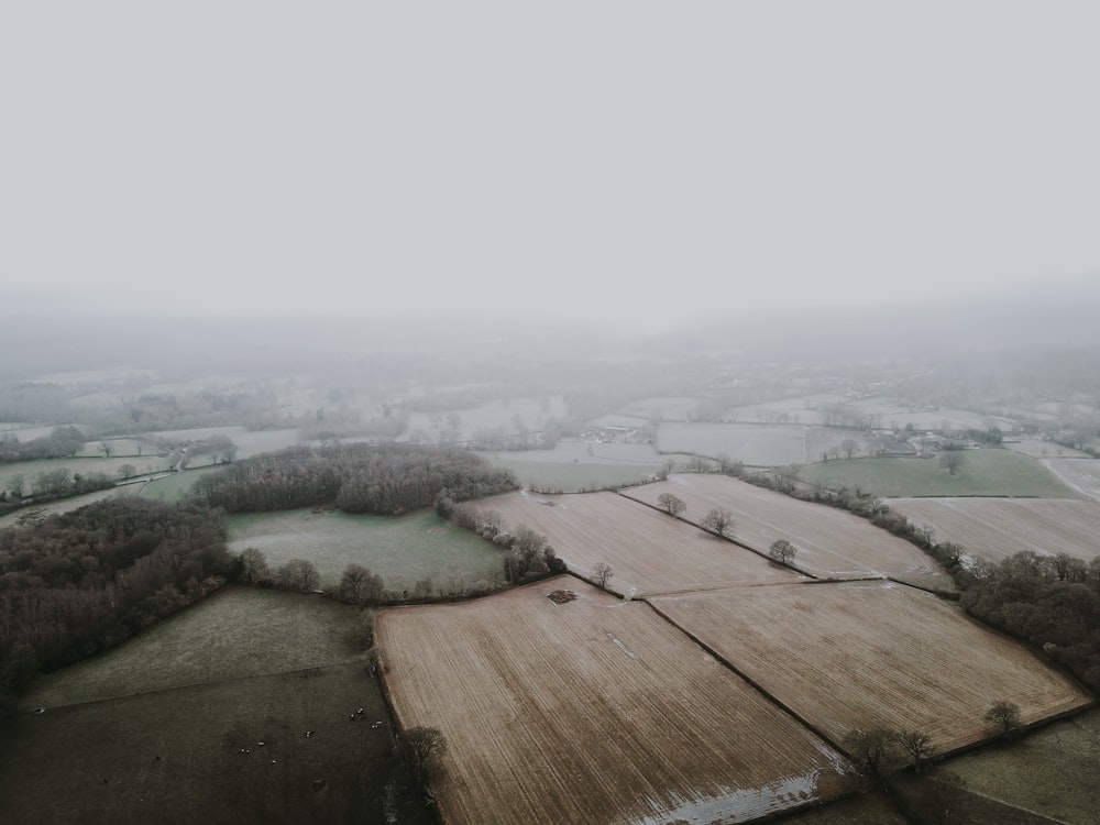 an aerial view of a foggy countryside